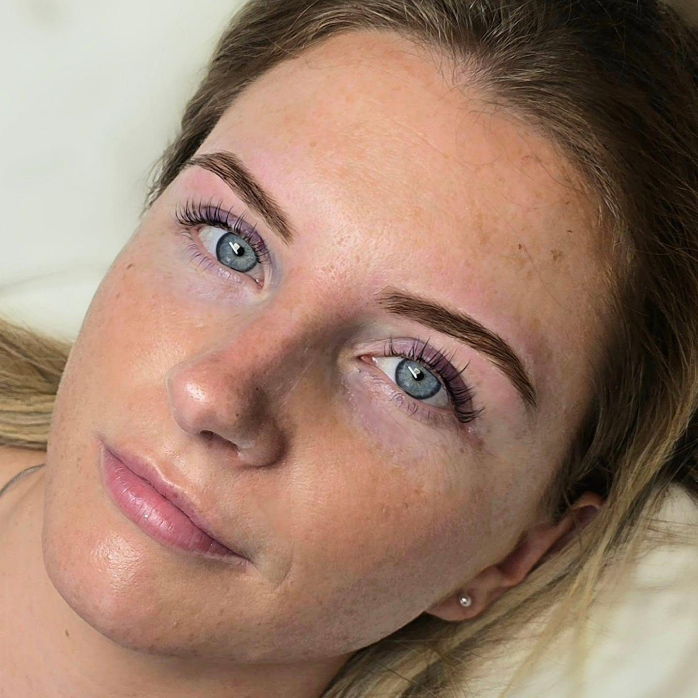 Client relaxing after lash and brow treatment